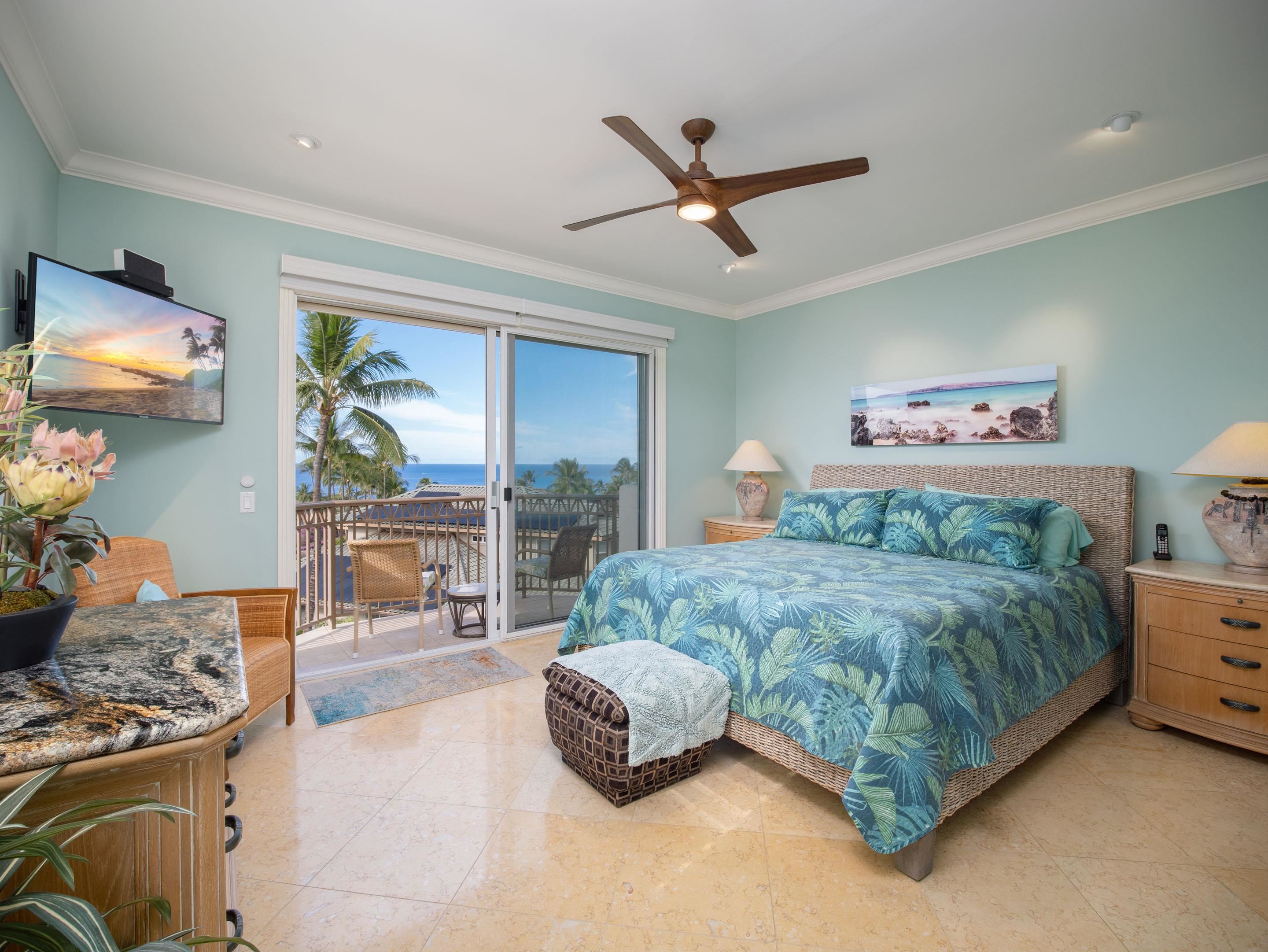 72 Kainui Loop, Unit 70A Kihei, HI 96753 - Photo 27 of 50 a living room with a bed furniture and a flat screen tv