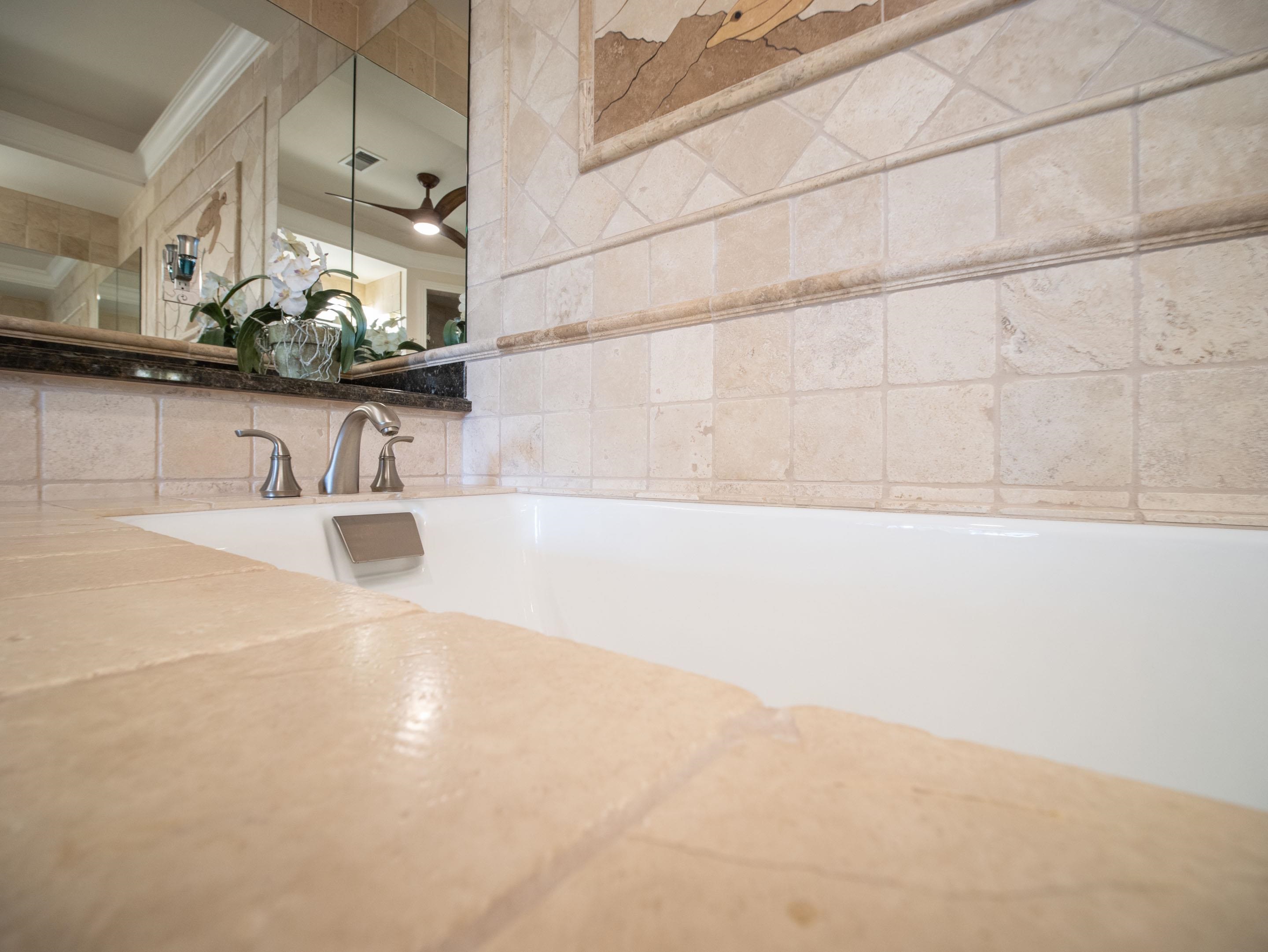 72 Kainui Loop, Unit 70A Kihei, HI 96753 - Photo 32 of 50 a bathroom with a sink and a mirror