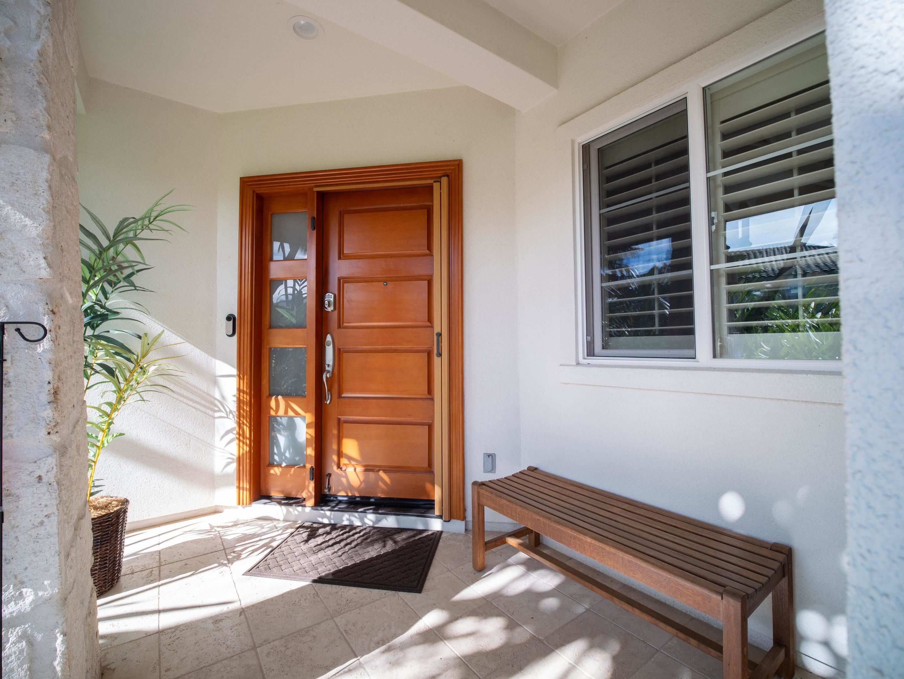 72 Kainui Loop, Unit 70A Kihei, HI 96753 - Photo 6 of 50 a wooden bench sitting in front of a building