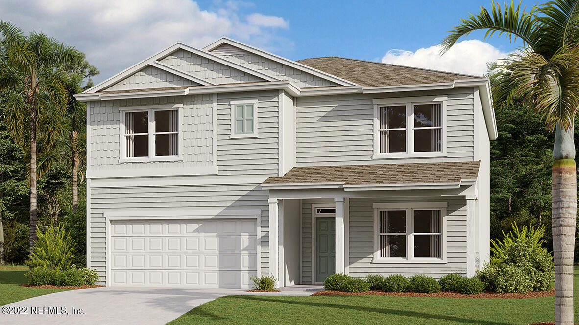 276 Falcon Ridge Road St. Augustine, FL 32084 - Photo 2 of 32 a front view of a house with a garden