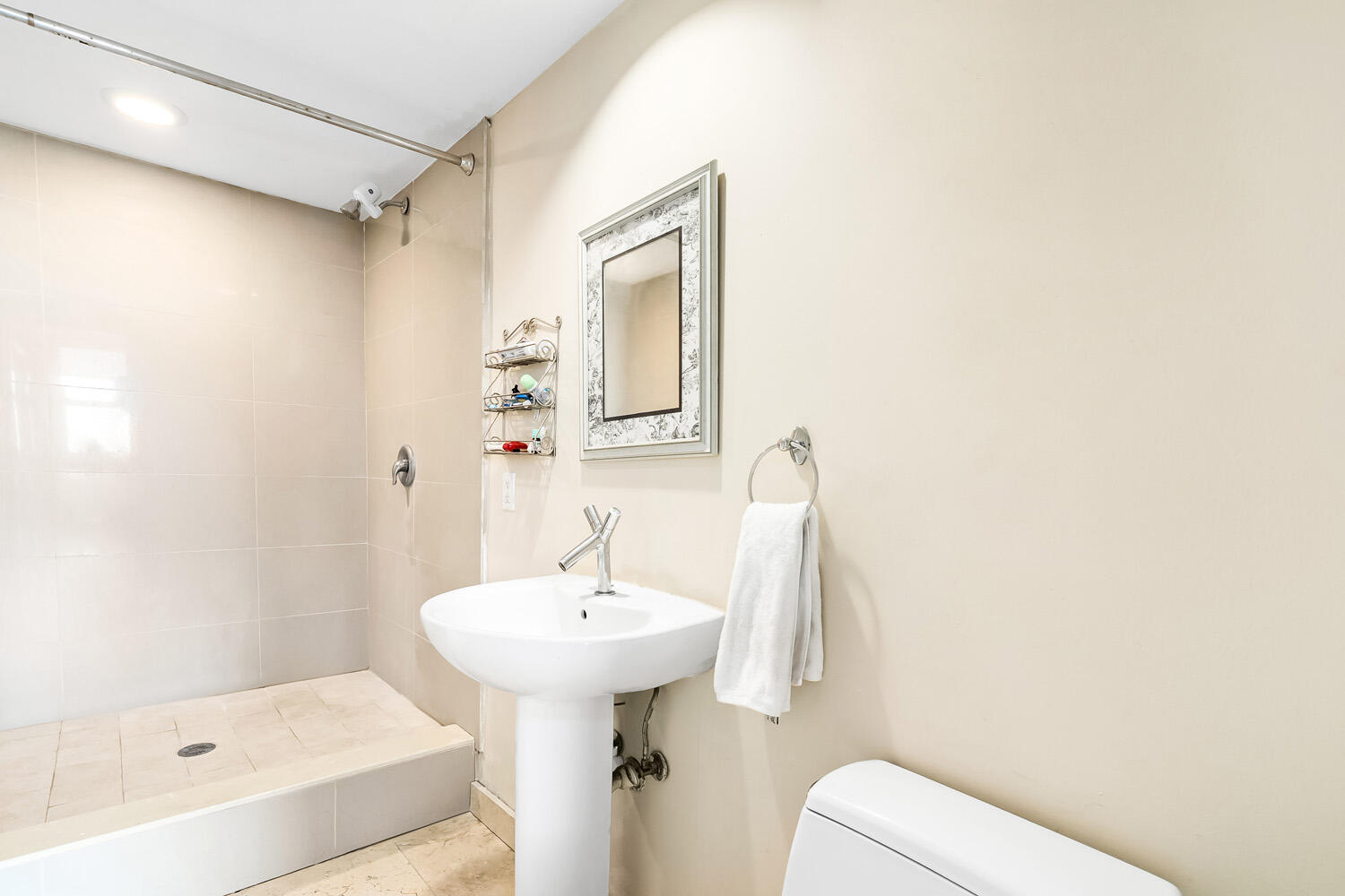 18911 Collins Avenue, Unit 506 ON 5 Sunny Isles Beach, FL 33160 - Photo 39 of 88 a bathroom with a sink a toilet and shower