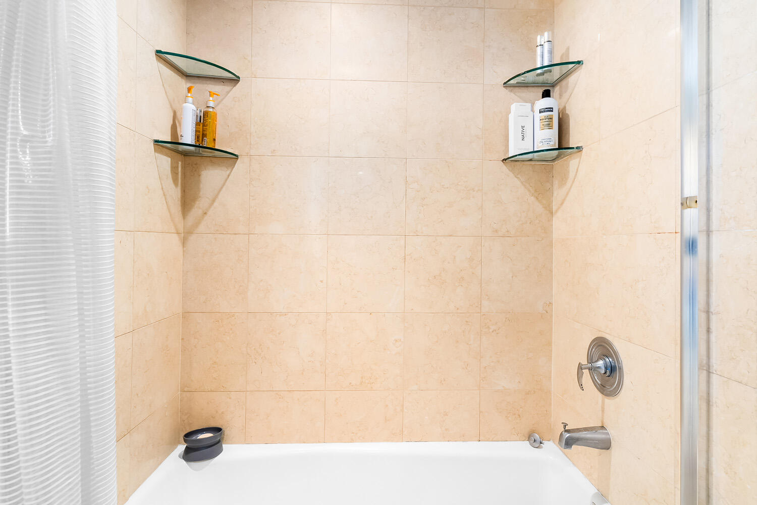 18911 Collins Avenue, Unit 506 ON 5 Sunny Isles Beach, FL 33160 - Photo 47 of 88 a bathroom with a bathtub and shower