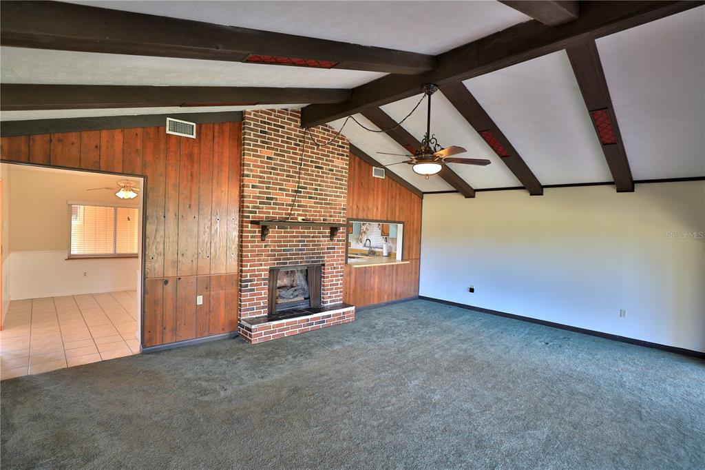 2155 Southeast County Highway 484 Belleview, FL 34420 - Photo 12 of 41 a view of a livingroom with an empty space and a window