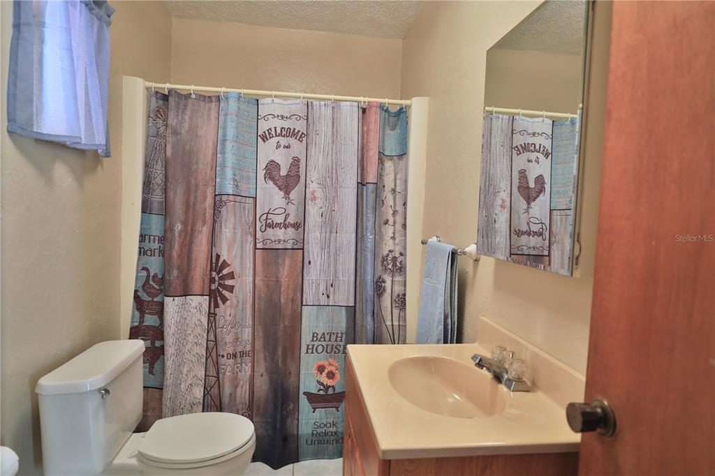 2155 Southeast County Highway 484 Belleview, FL 34420 - Photo 20 of 41 a bathroom with a sink toilet and shower