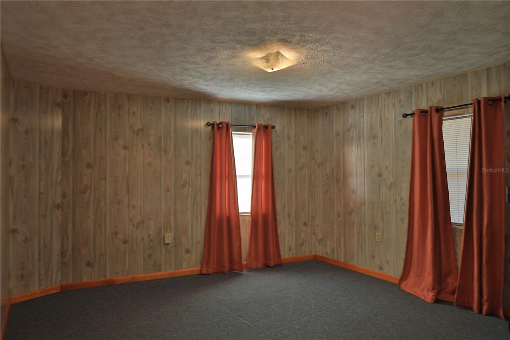 2155 Southeast County Highway 484 Belleview, FL 34420 - Photo 21 of 41 an empty room with windows and closet