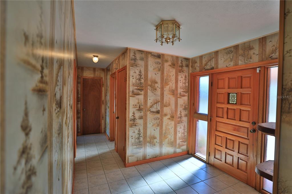 2155 Southeast County Highway 484 Belleview, FL 34420 - Photo 3 of 41 a view of entryway with a door