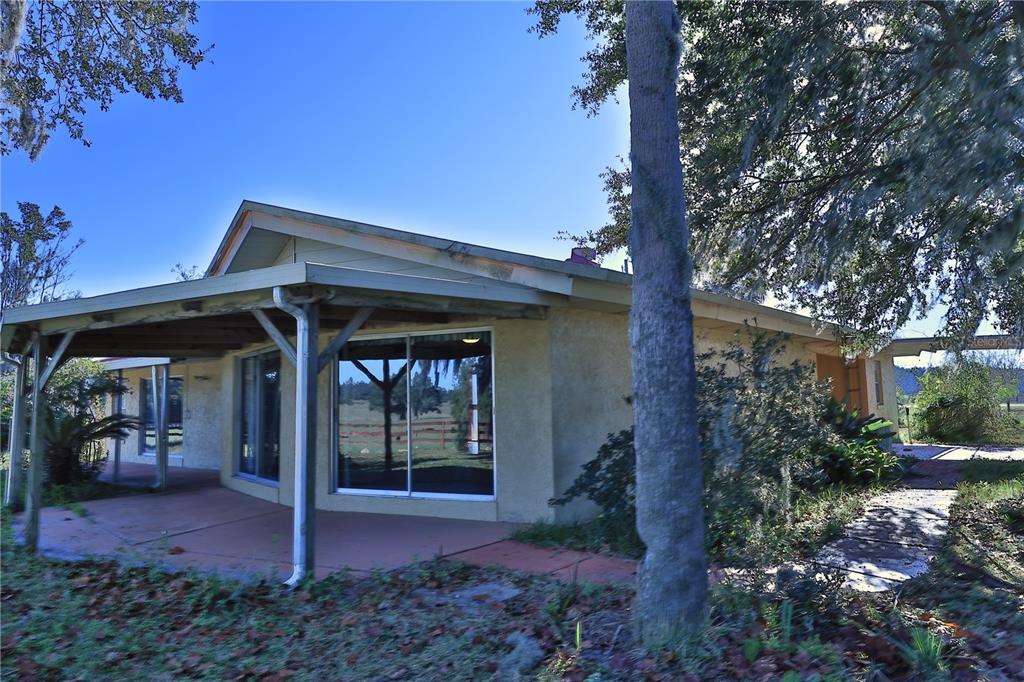 2155 Southeast County Highway 484 Belleview, FL 34420 - Photo 33 of 41 a view of a porch with a yard
