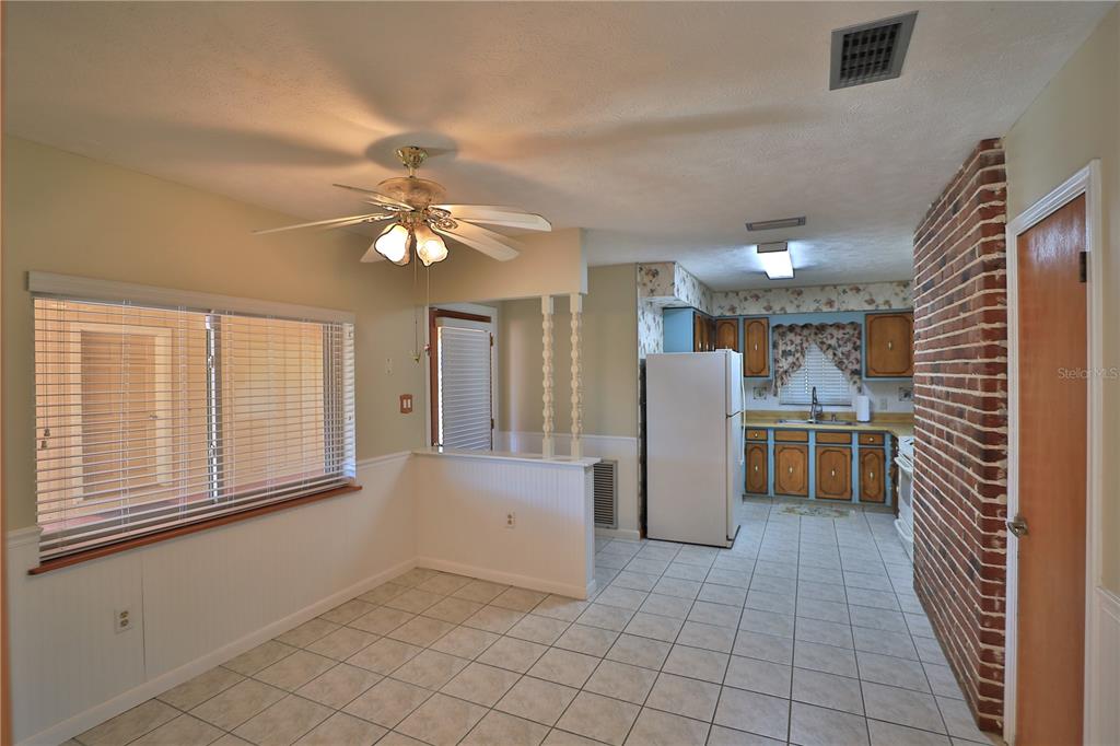 2155 Southeast County Highway 484 Belleview, FL 34420 - Photo 6 of 41 a view of kitchen with furniture and a ceiling fan
