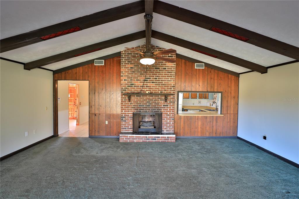 2155 Southeast County Highway 484 Belleview, FL 34420 - Photo 9 of 41 a view of a room with wooden floor and windows