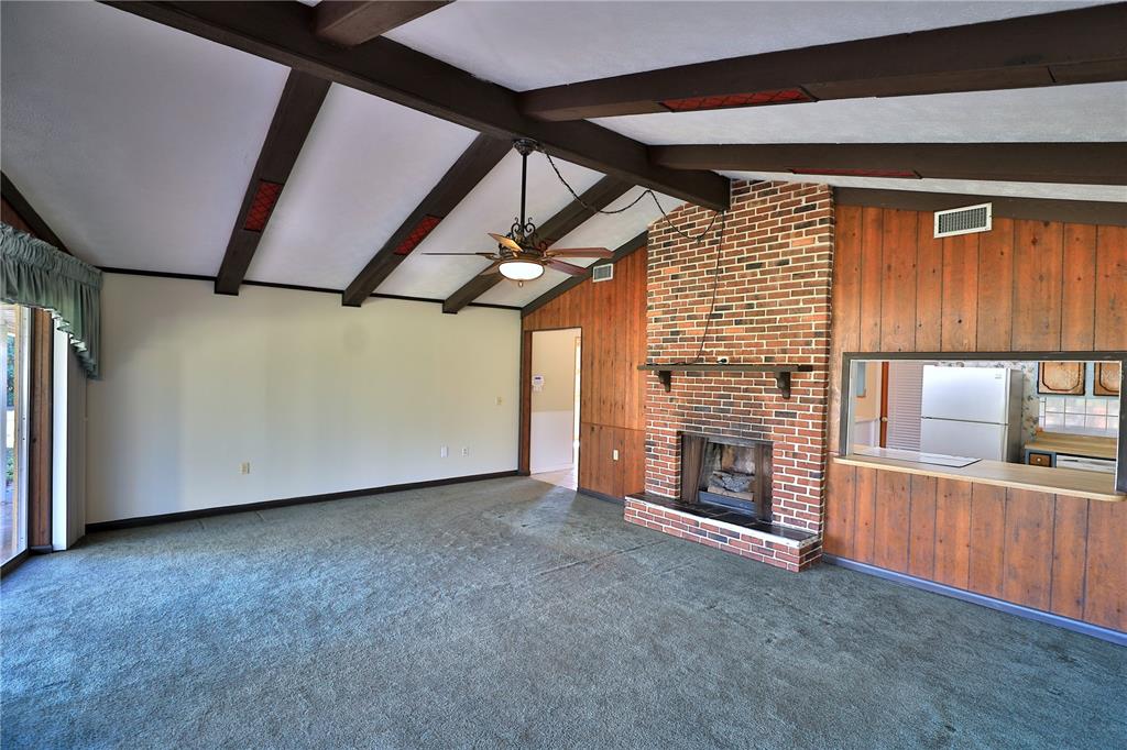 2155 Southeast County Highway 484 Belleview, FL 34420 - Photo 10 of 41 a view of an empty room with a fireplace