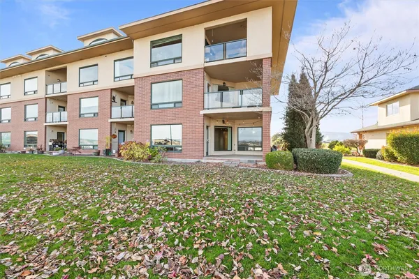 a view of a room with wooden floor and mountain view