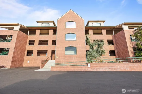 a front view of a house with a road