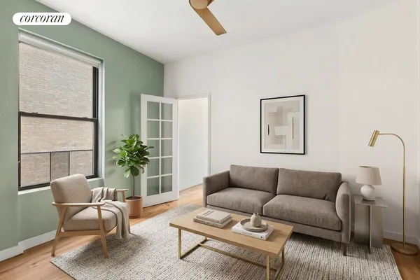 a living room with furniture and a potted plant