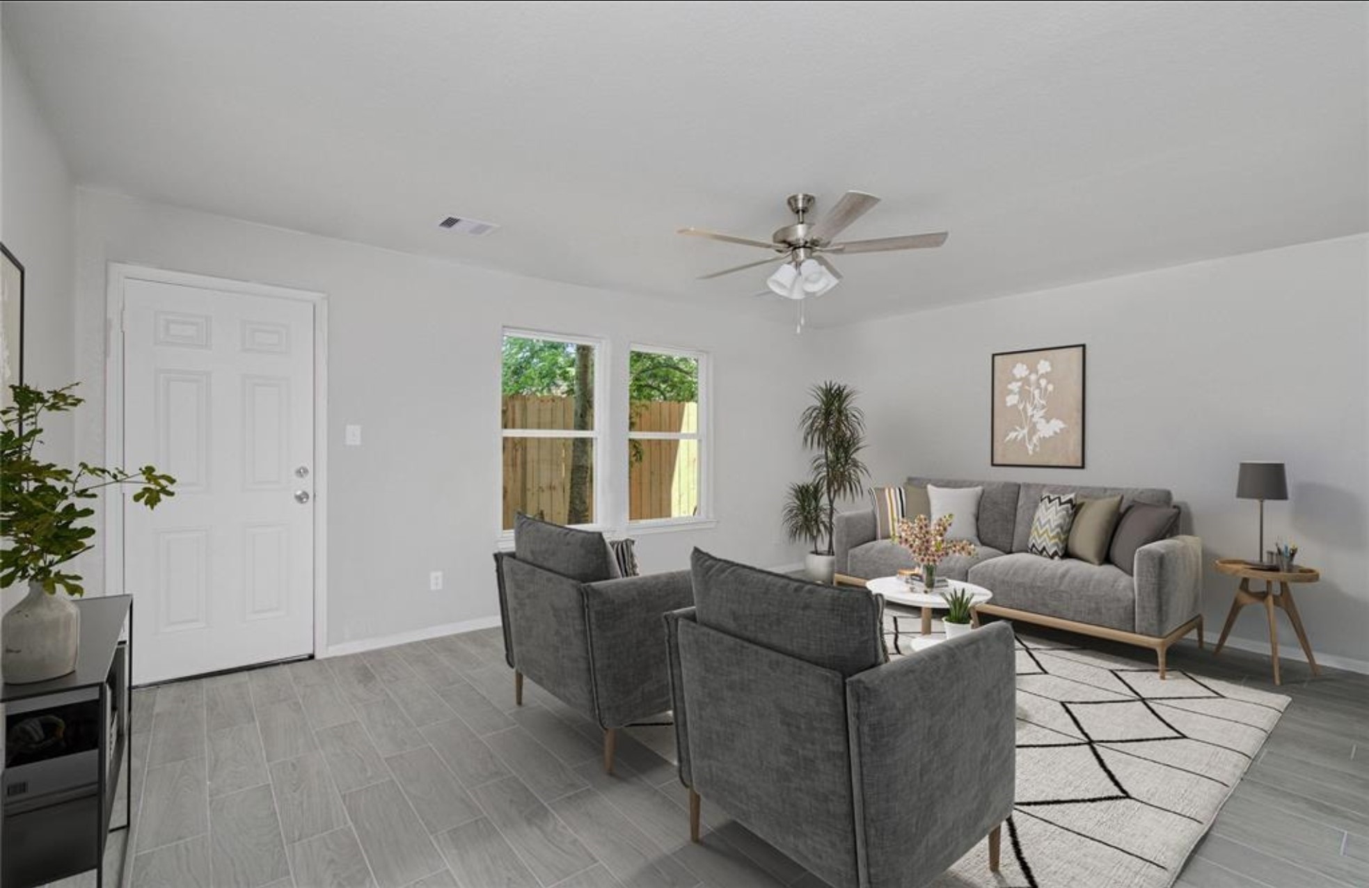8209 Westcott Road Houston, TX 77016 - Photo 5 of 19 a living room with furniture a chandelier and a window