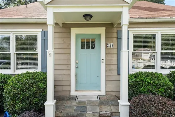 a front view of a house with a glass door