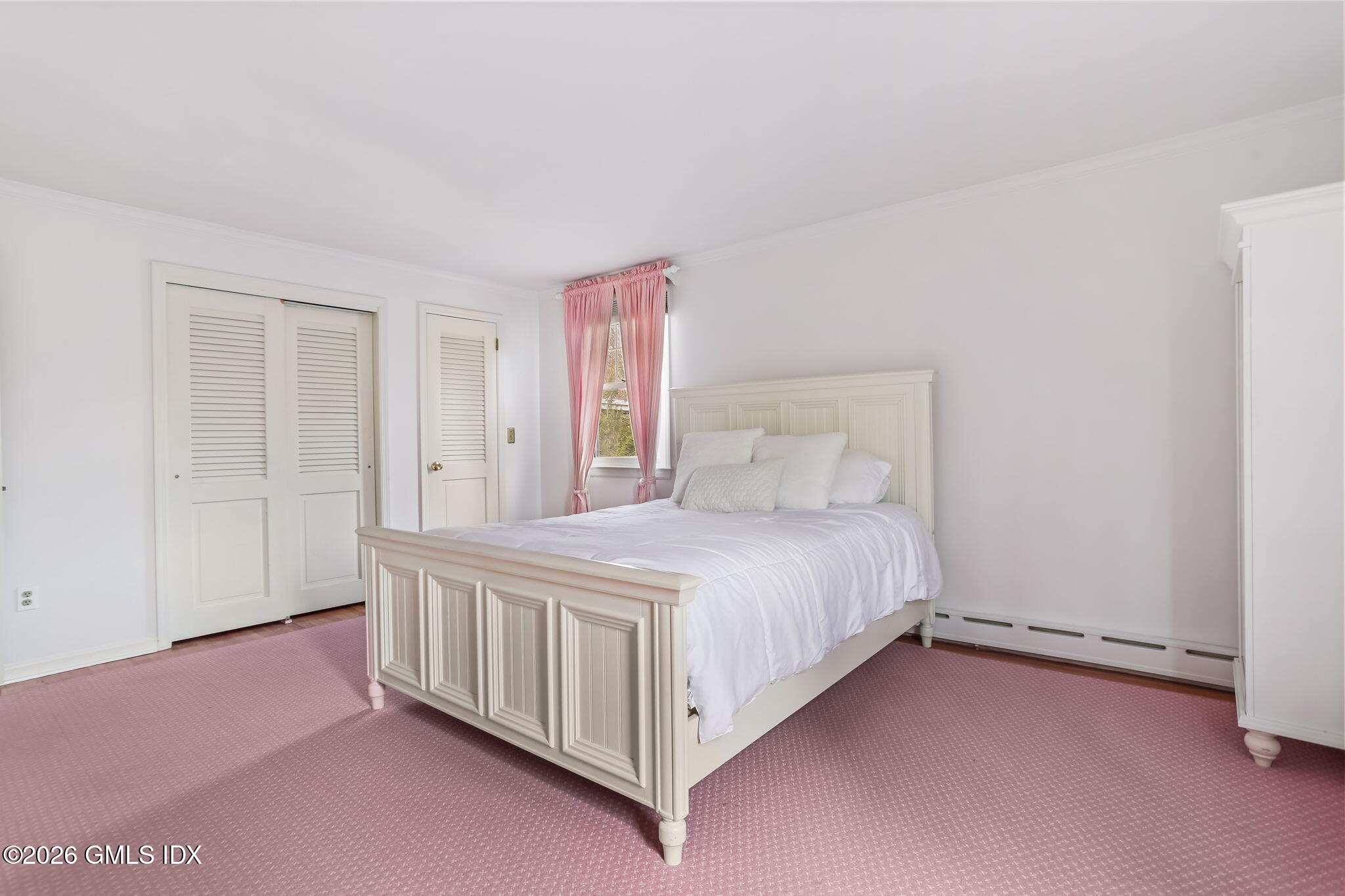 153 Lockwood Road Riverside, CT 06878 - Photo 36 of 58 a bedroom with a bed and a window