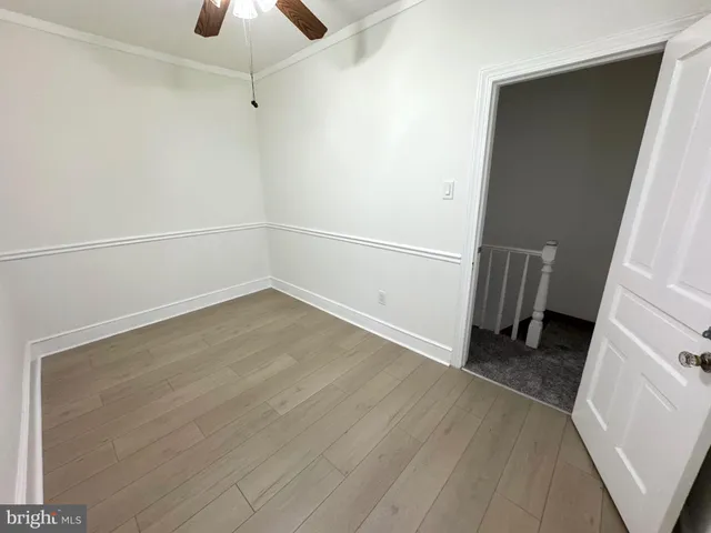 a view of an empty room with a fireplace