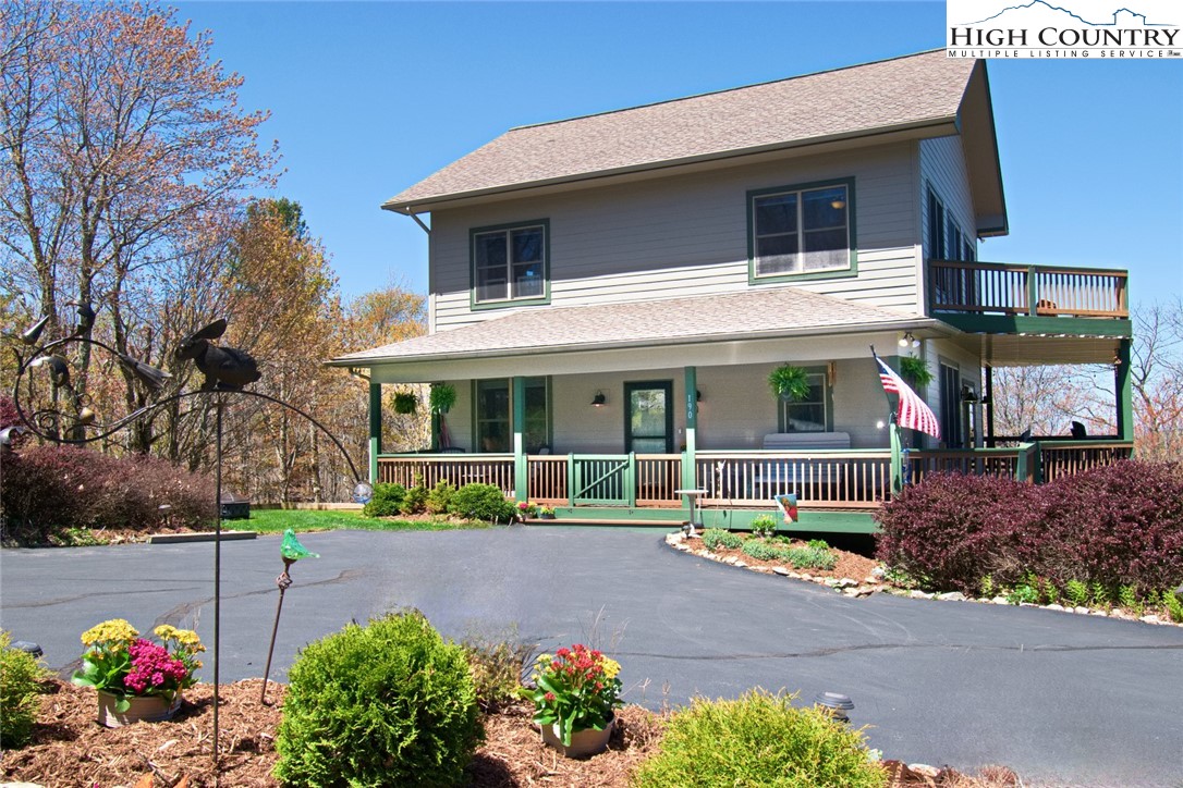 190 Summit Park Circle Boone, NC 28607 - Photo 1 of 50 a front view of a house with garden