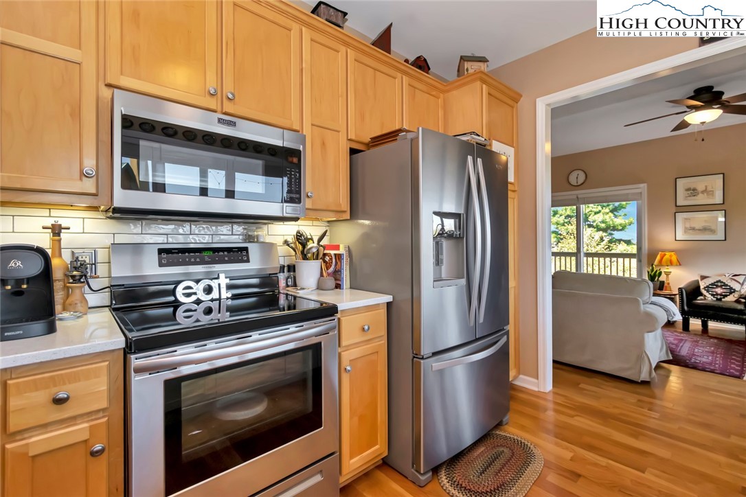 190 Summit Park Circle Boone, NC 28607 - Photo 12 of 50 a kitchen with stainless steel appliances granite countertop a refrigerator stove and sink
