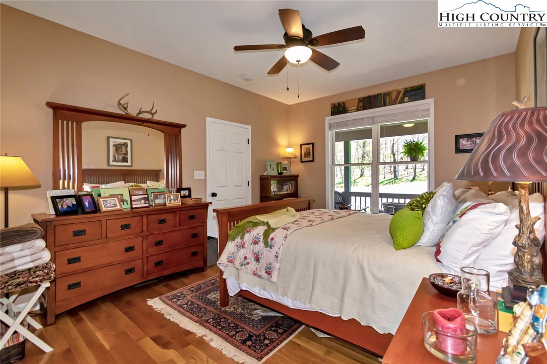 190 Summit Park Circle Boone, NC 28607 - Photo 19 of 50 a bed room with a bed mirror and a window