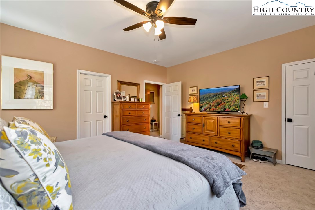 190 Summit Park Circle Boone, NC 28607 - Photo 26 of 50 a bedroom with a bed and a dresser