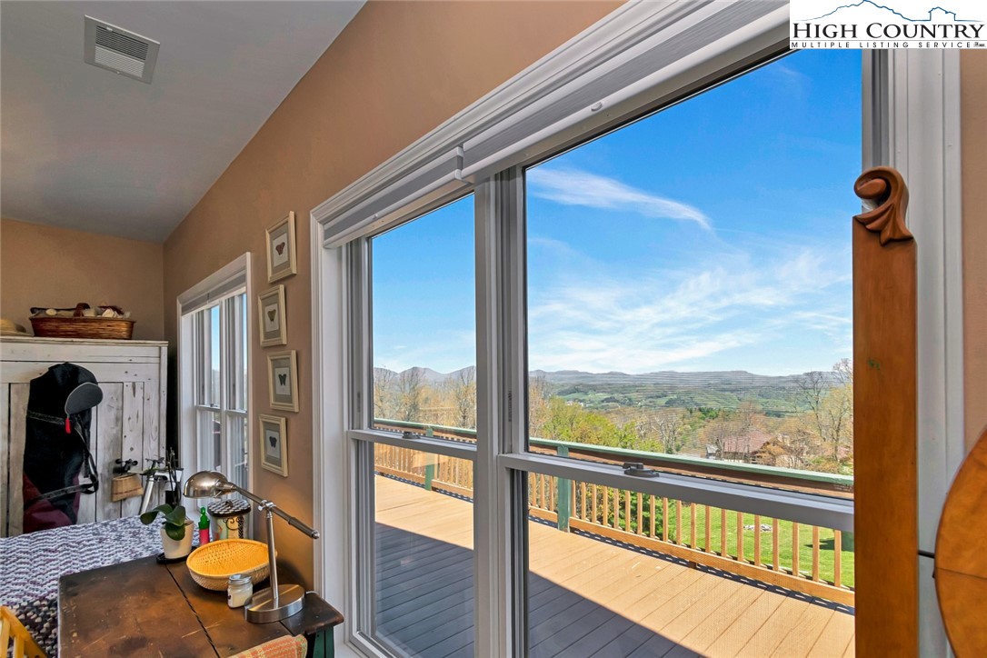 190 Summit Park Circle Boone, NC 28607 - Photo 33 of 50 a view of a balcony with chair and wooden floor
