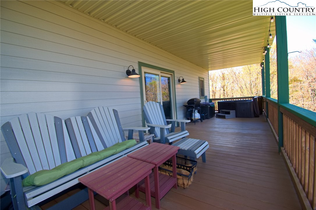 190 Summit Park Circle Boone, NC 28607 - Photo 39 of 50 a backyard of a house with wooden floor outdoor seating and furniture