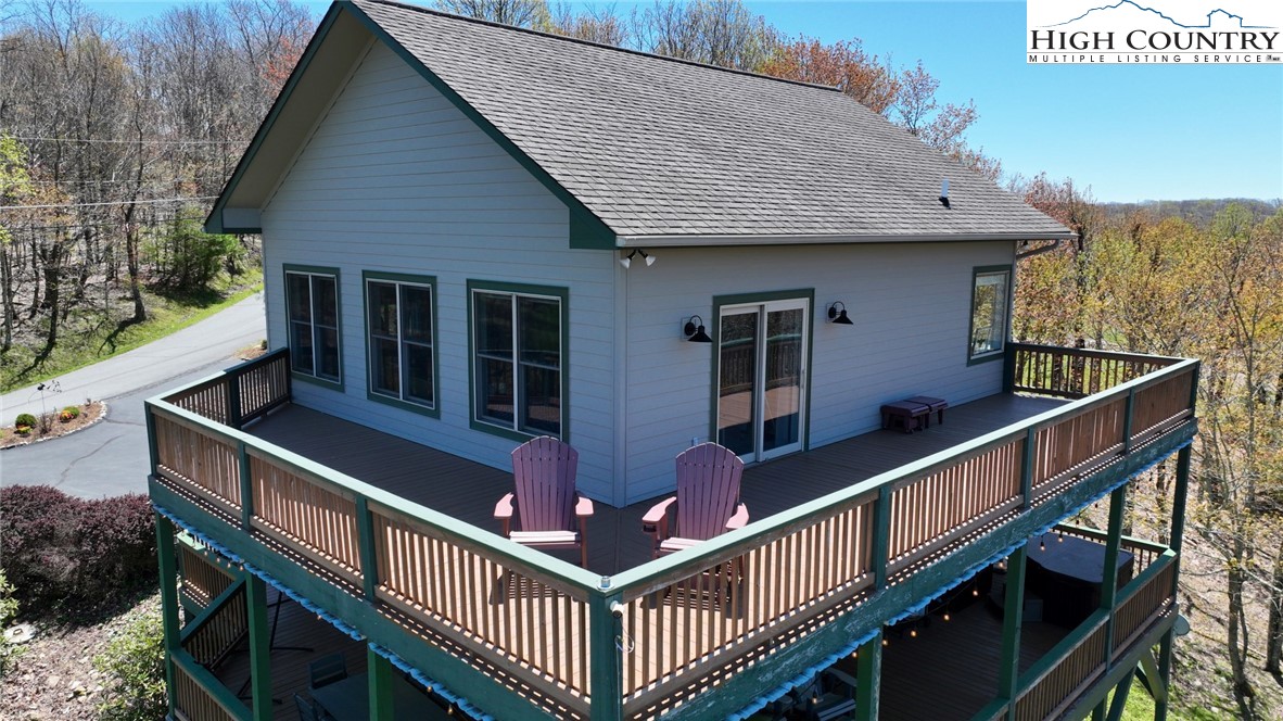 190 Summit Park Circle Boone, NC 28607 - Photo 4 of 50 a view of a house with wooden deck stairs and a sink