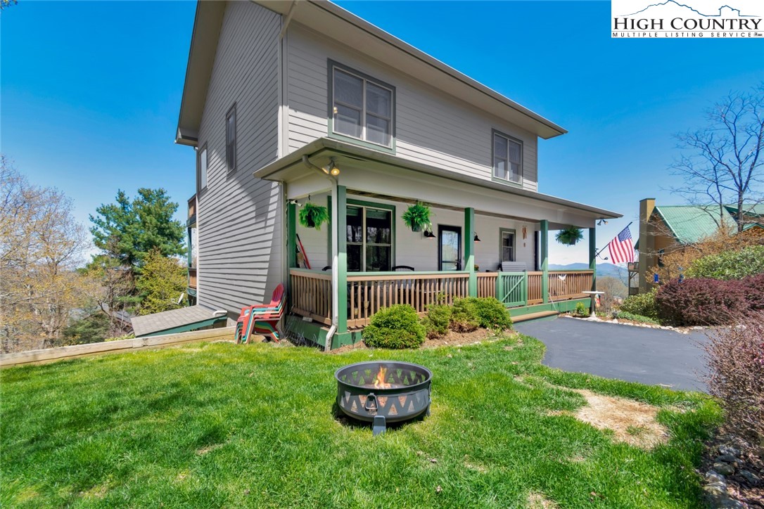 190 Summit Park Circle Boone, NC 28607 - Photo 5 of 50 a front view of a house with a garden and plants