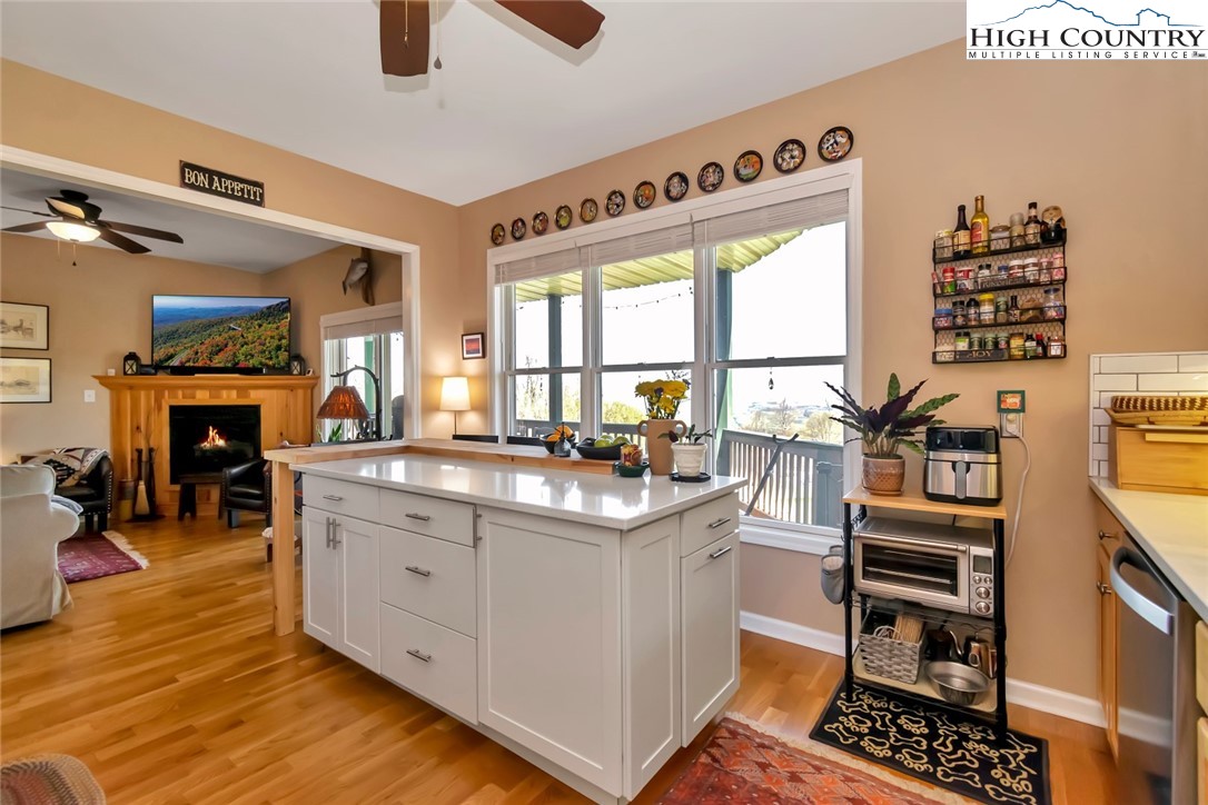 190 Summit Park Circle Boone, NC 28607 - Photo 9 of 50 a kitchen with stainless steel appliances granite countertop a stove and a large window