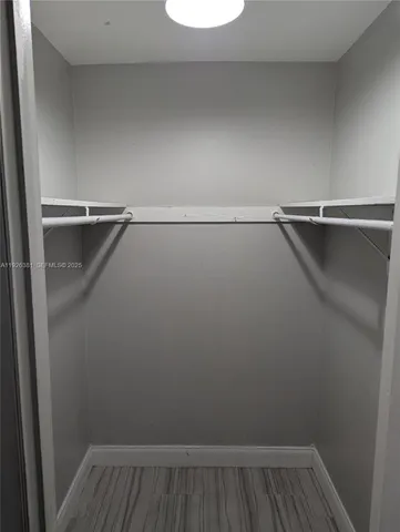 a view of a room with racks on the wall