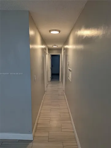 a view of hallway with stairs