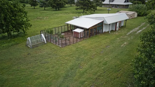 an aerial view of a house having yard