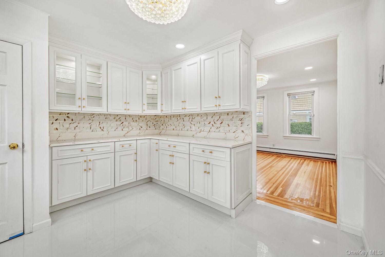 37 Keystone Place Hewlett, NY 11557 - Photo 18 of 45 a view of a kitchen with white cabinets