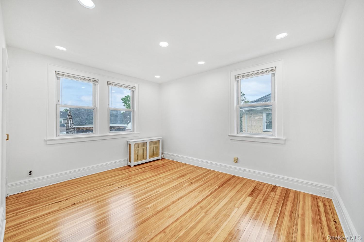 37 Keystone Place Hewlett, NY 11557 - Photo 25 of 45 a room with a window and wooden floor