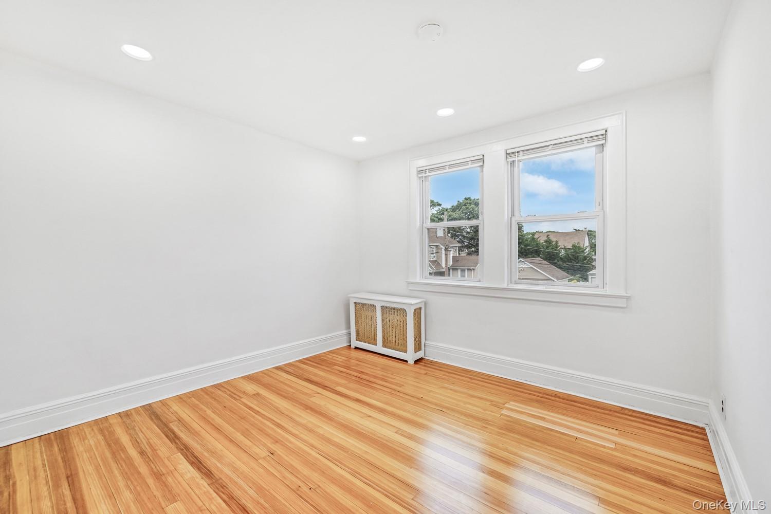 37 Keystone Place Hewlett, NY 11557 - Photo 27 of 45 a view of a room with wooden floor and window