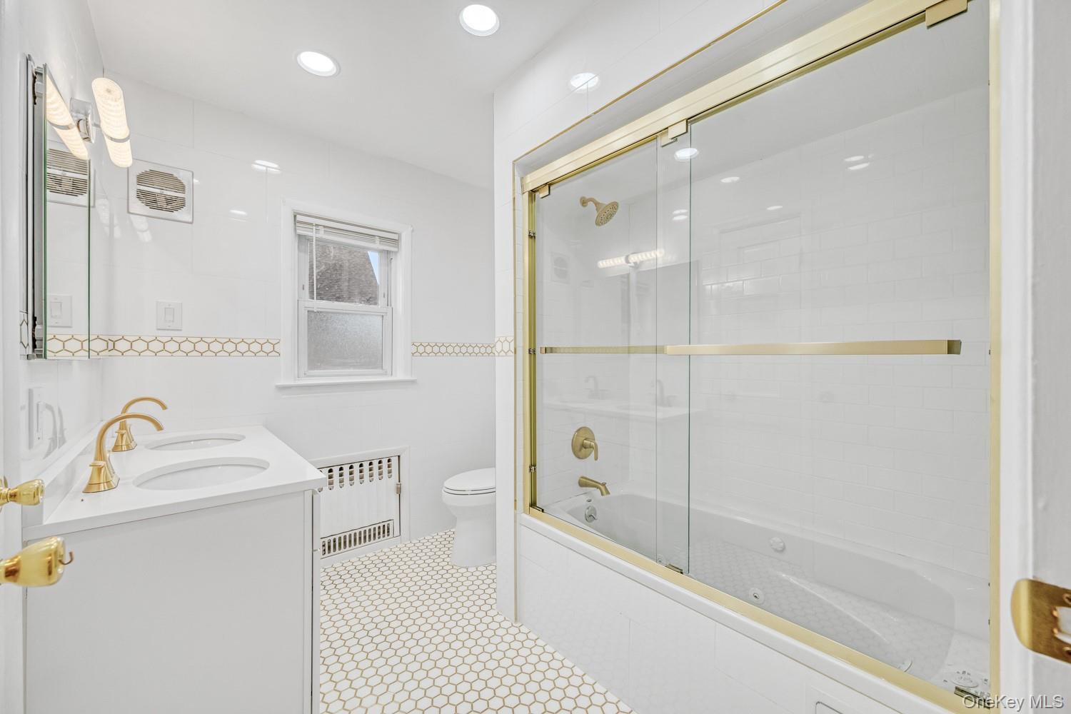 37 Keystone Place Hewlett, NY 11557 - Photo 29 of 45 a bathroom with a sink a toilet and shower