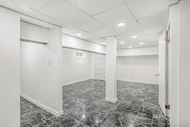 a bathroom with a shower and a glass door