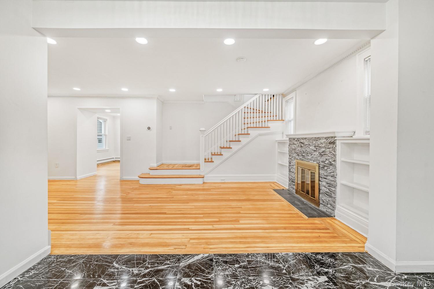 37 Keystone Place Hewlett, NY 11557 - Photo 4 of 45 a view of an empty room with wooden floor
