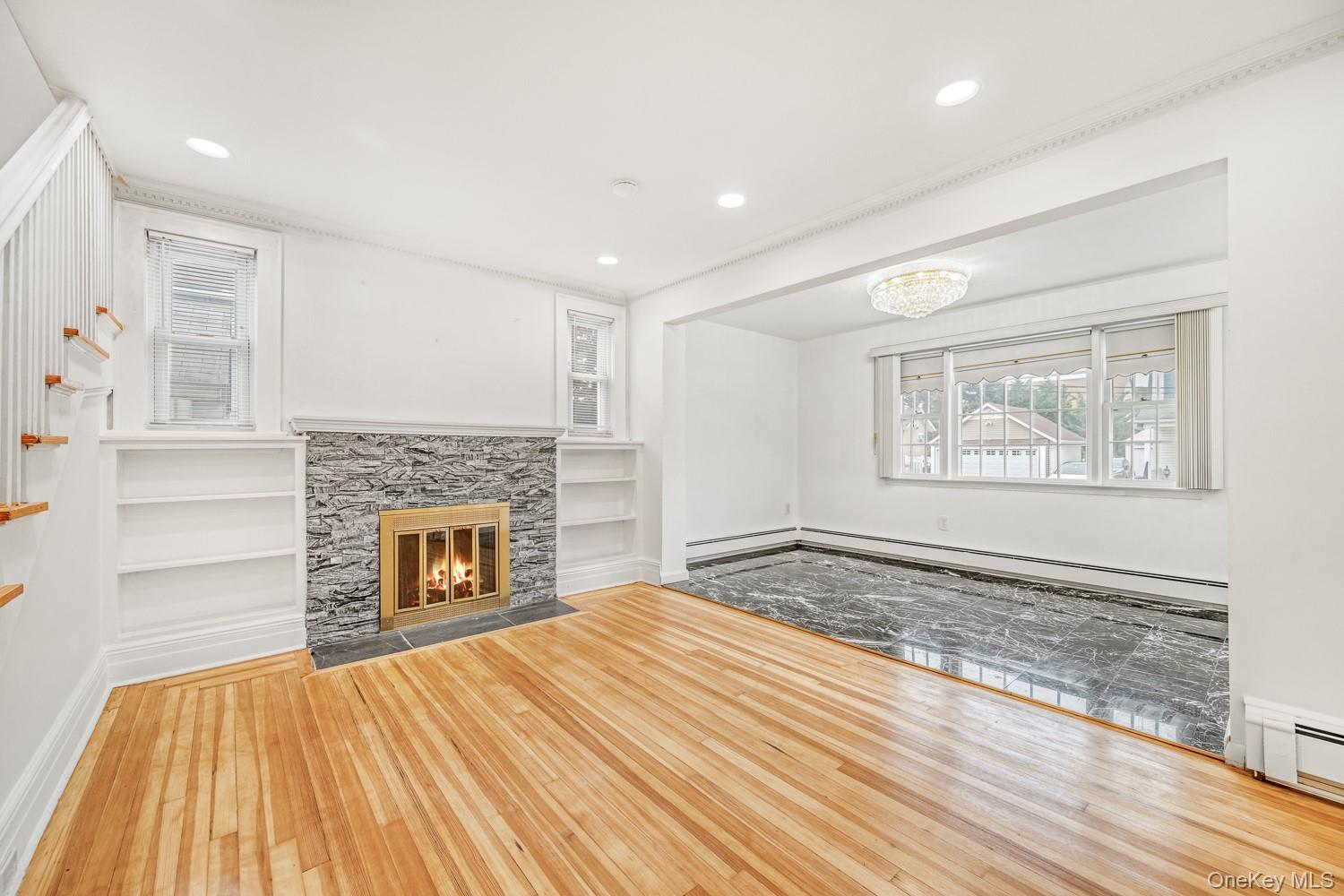 37 Keystone Place Hewlett, NY 11557 - Photo 10 of 45 a view of empty room with wooden floor and fireplace