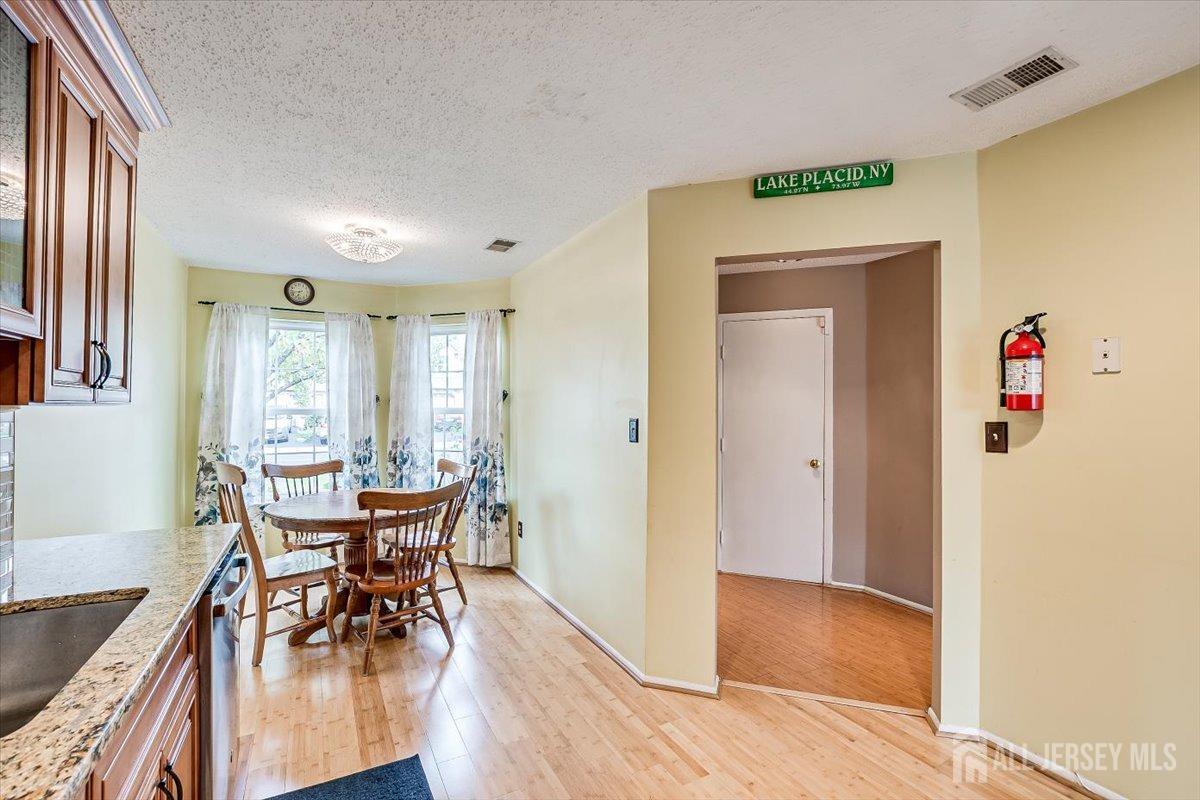230 Nebula Road Piscataway, NJ 08854 - Photo 11 of 33 a view of a dining room with furniture and a window