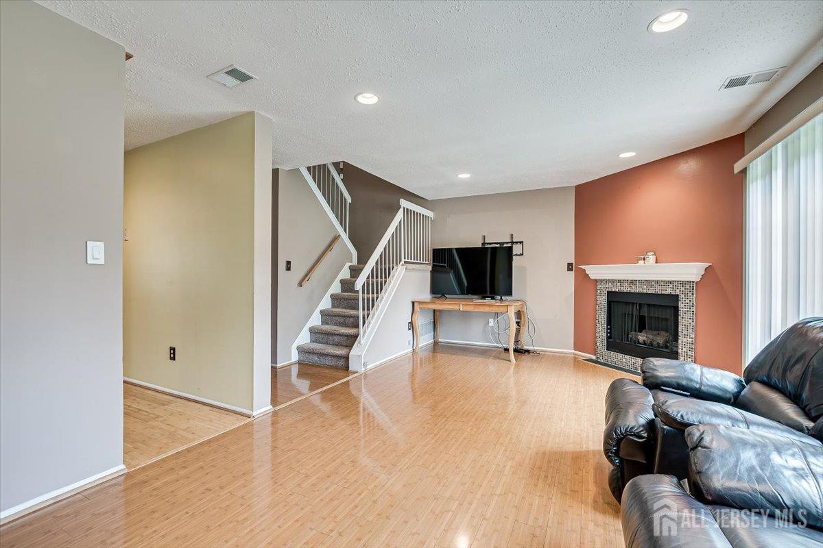 230 Nebula Road Piscataway, NJ 08854 - Photo 13 of 33 a living room with furniture and a fireplace