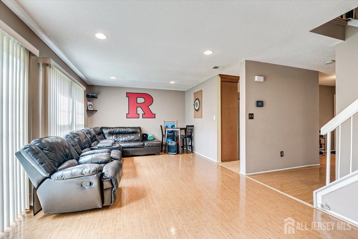 230 Nebula Road Piscataway, NJ 08854 - Photo 15 of 33 a living room with furniture and a flat screen tv