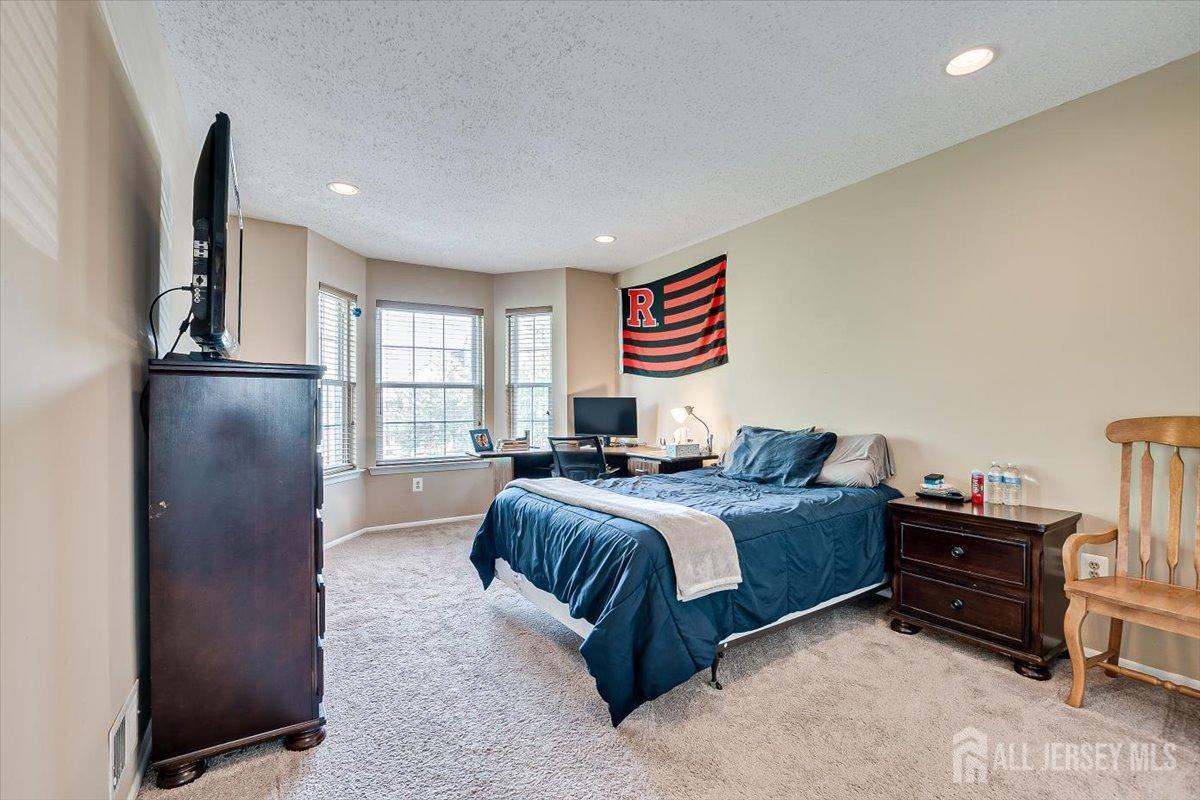 230 Nebula Road Piscataway, NJ 08854 - Photo 19 of 33 a bedroom with bed and a large window