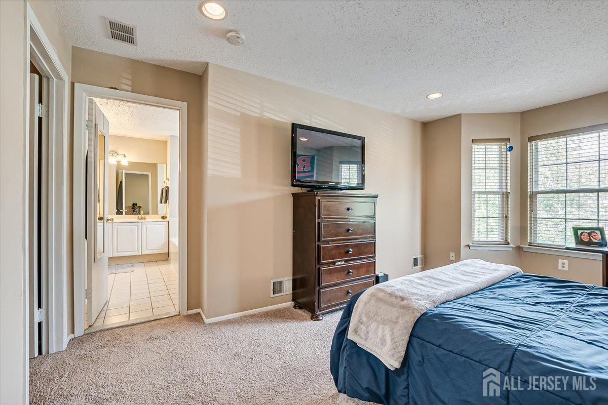 230 Nebula Road Piscataway, NJ 08854 - Photo 20 of 33 a bedroom with a bed and a television