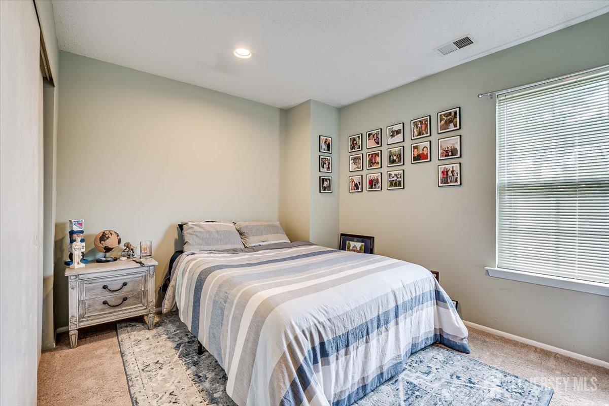 230 Nebula Road Piscataway, NJ 08854 - Photo 24 of 33 a bedroom with a bed and a window