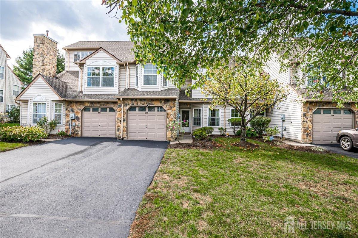 230 Nebula Road Piscataway, NJ 08854 - Photo 3 of 33 a front view of a house with a yard and garage