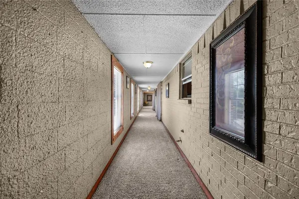 a view of a pathway along the house