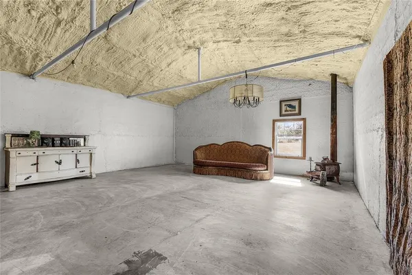 a view of a livingroom with furniture and garage