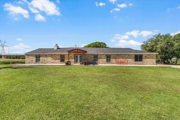 a front view of house with yard and seating area